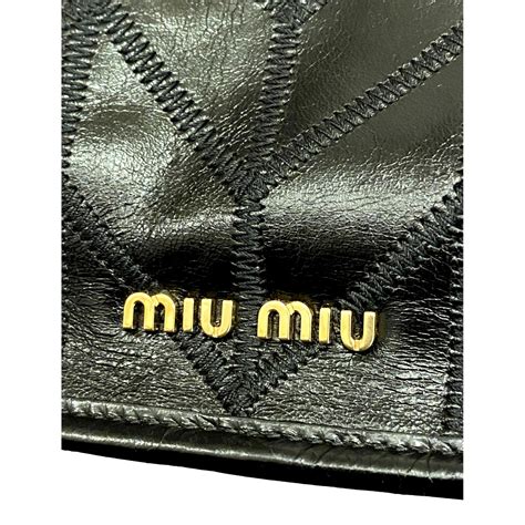 Shop Miu Miu at Queen Bee of Beverly Hills 